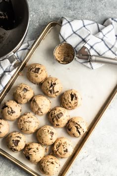 Picture of multiple cookie dough balls on sheet